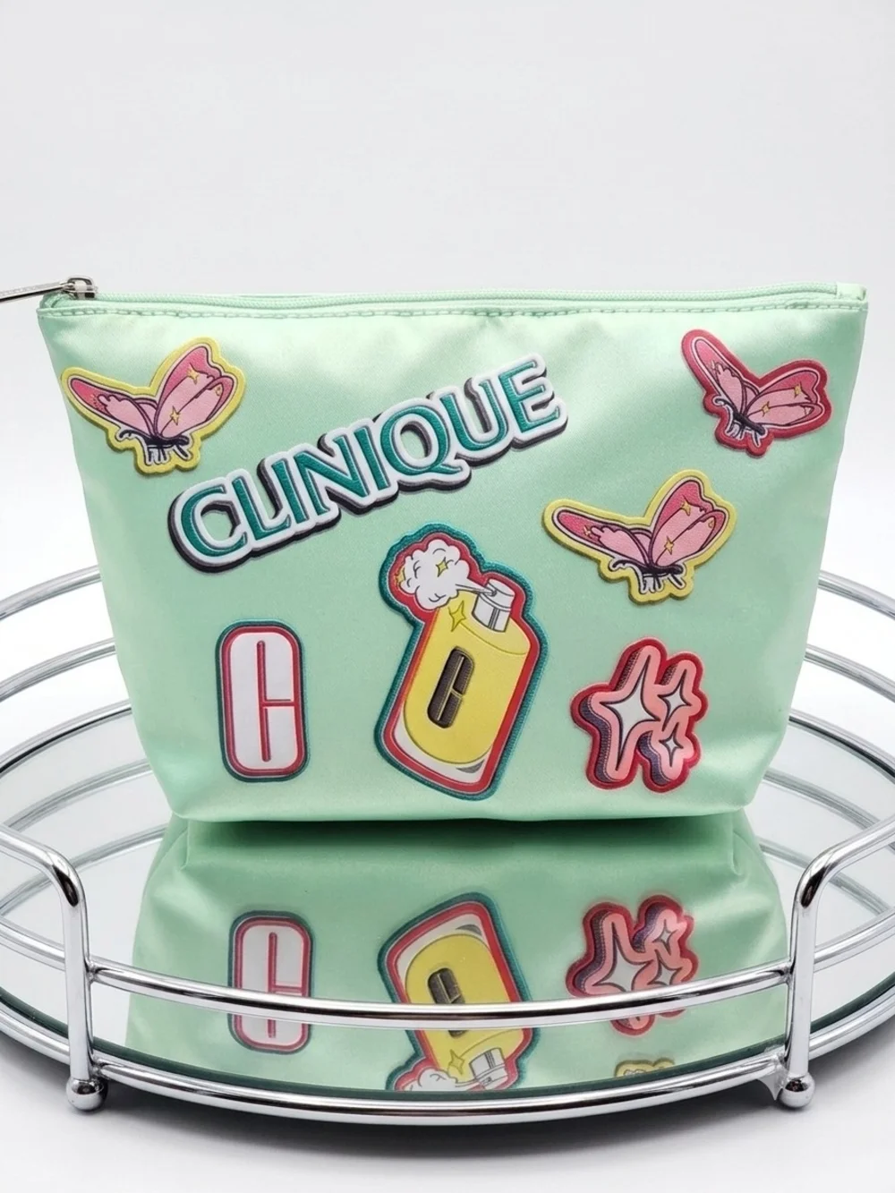 Clinique Mint Green Cosmetic Pouch with Pink and Yellow Accents